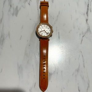 Michael Kors watch with tan leather band.